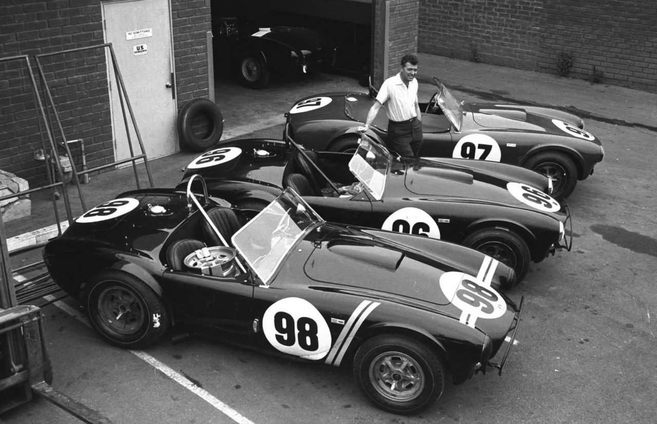 Image of three Shelby Cobras and Carroll Shelby